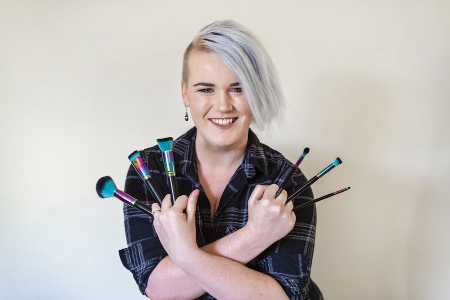 Jac Travers with makeup brushes