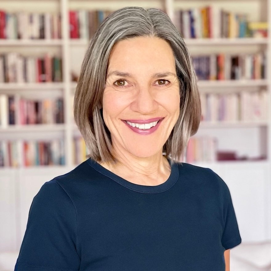 Kate James in front of a bookcase